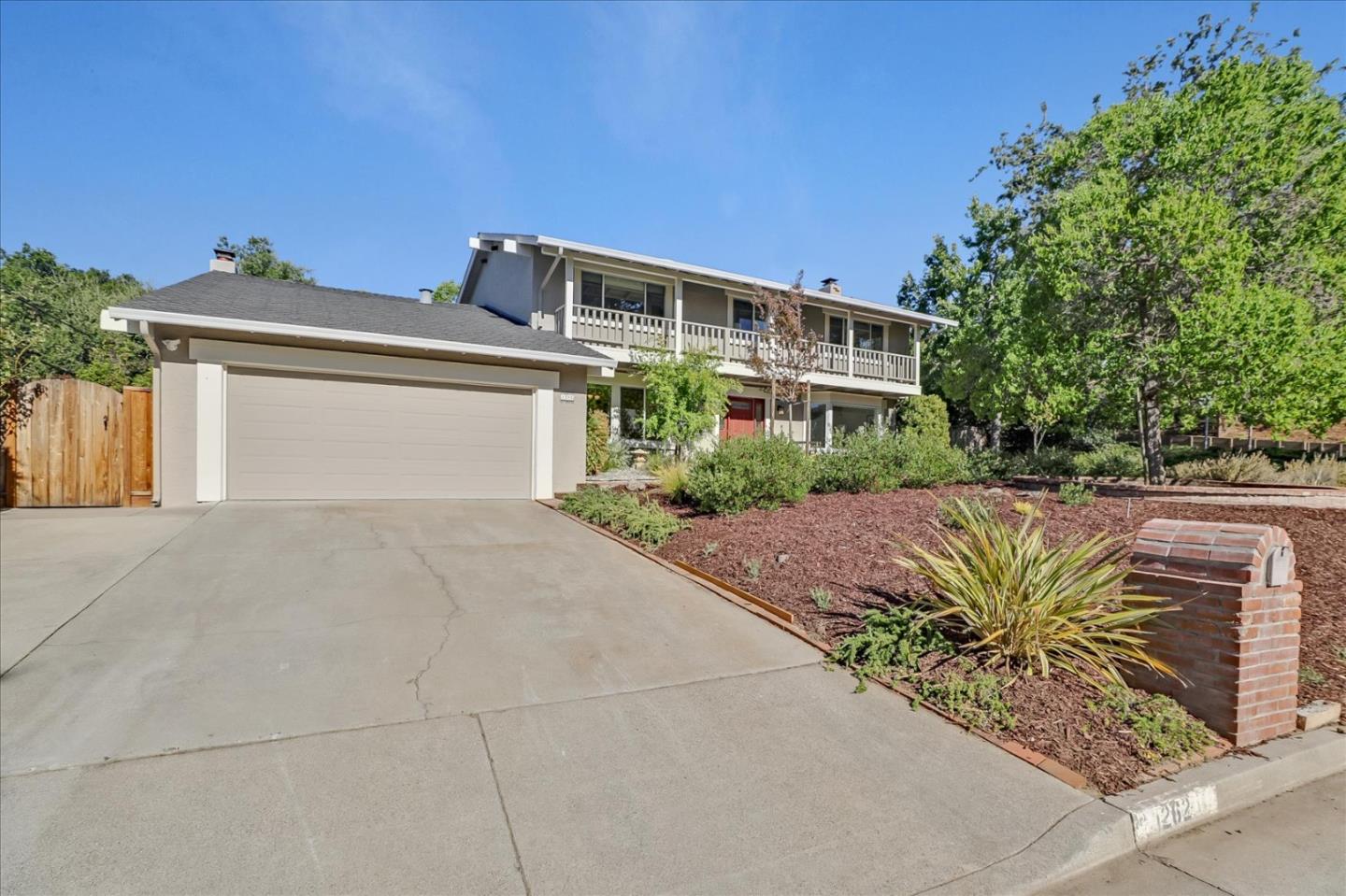 1262 Chateau Drive San Jose, CA 95120 - Photo 2 of 57 a front view of a house with garden