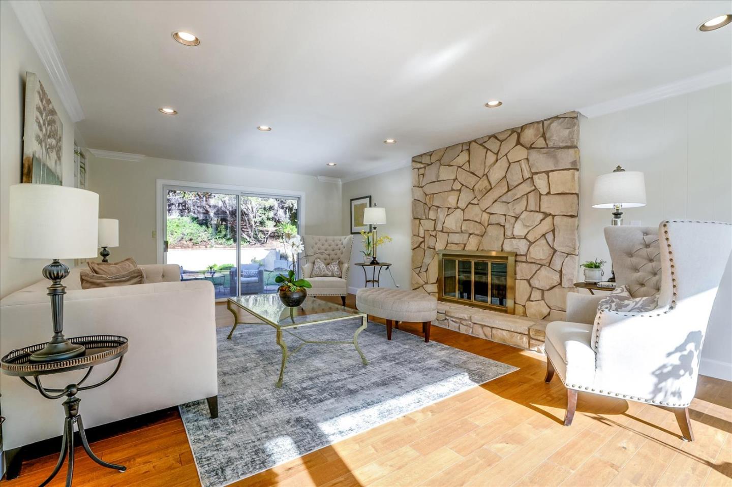 1262 Chateau Drive San Jose, CA 95120 - Photo 22 of 57 a living room with furniture a fireplace and a floor to ceiling window