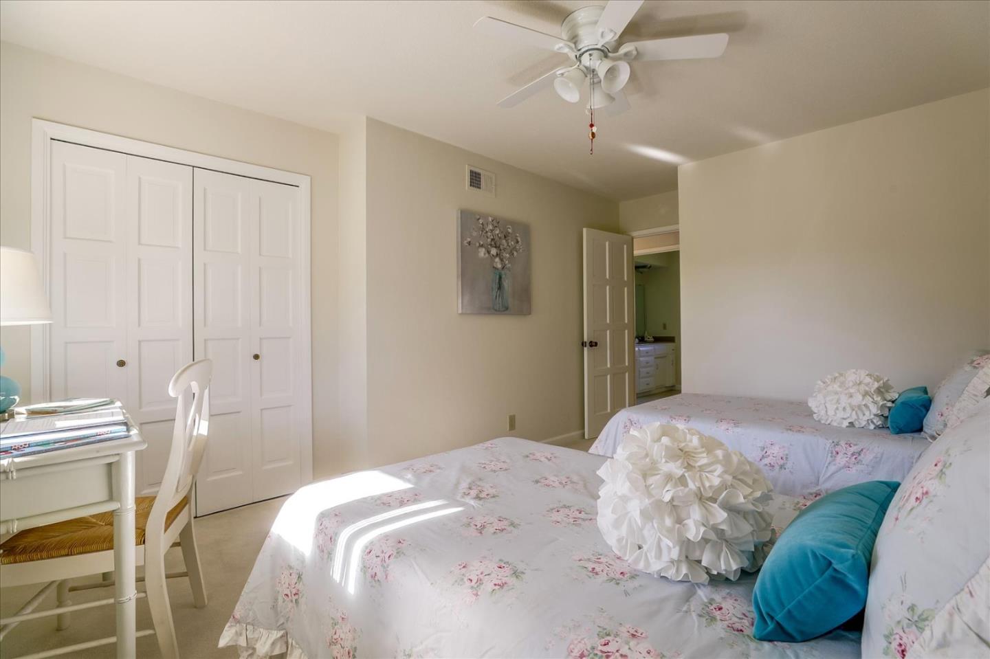 1262 Chateau Drive San Jose, CA 95120 - Photo 34 of 57 a bedroom with a bed and a chandelier