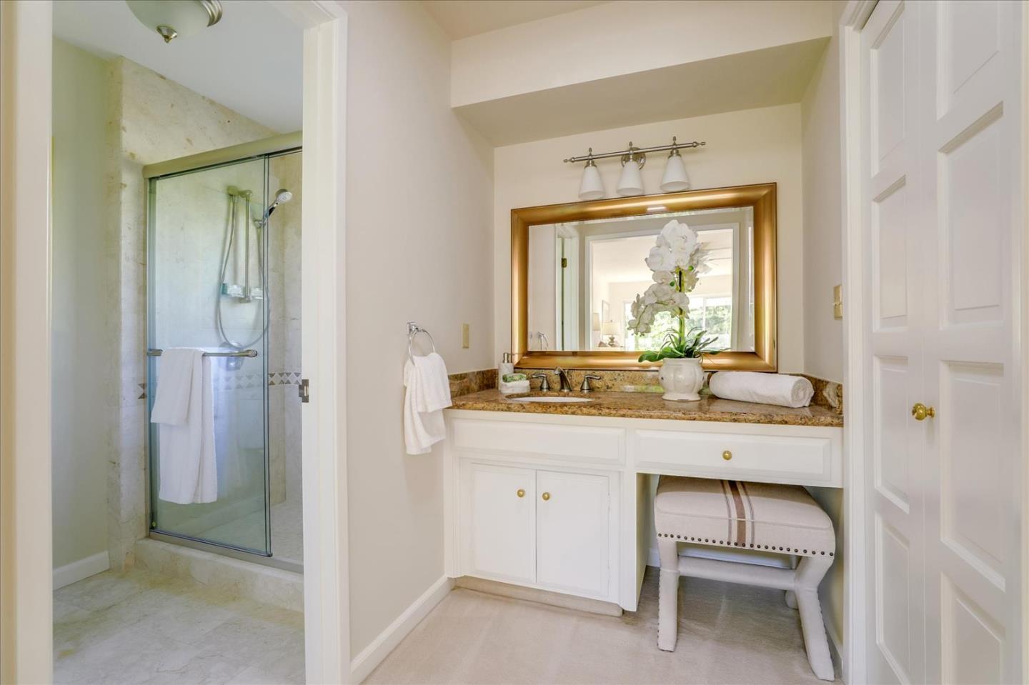 1262 Chateau Drive San Jose, CA 95120 - Photo 42 of 57 a bathroom with a granite countertop sink a toilet and a mirror