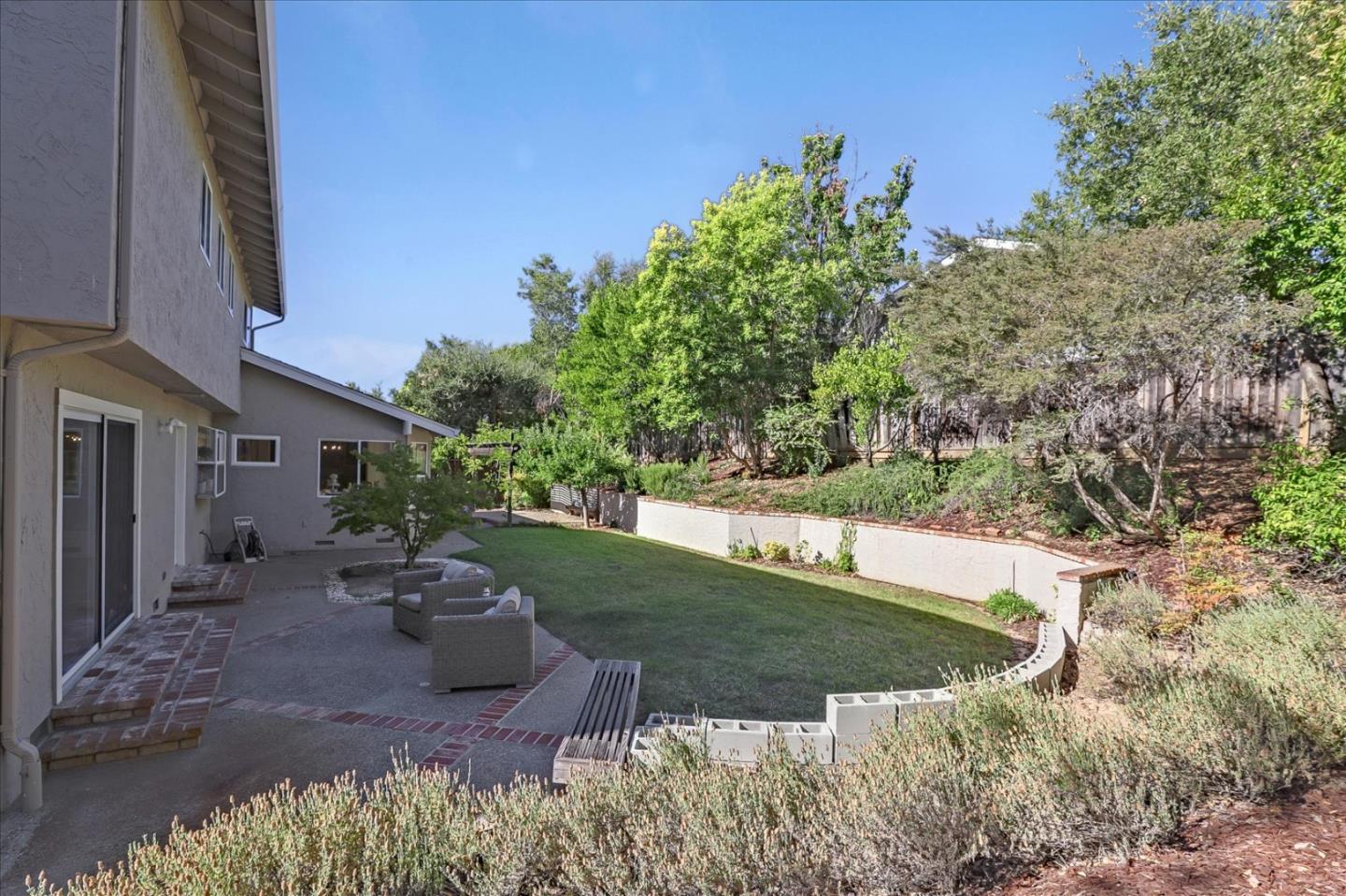 1262 Chateau Drive San Jose, CA 95120 - Photo 47 of 57 a view of a backyard with plants and a patio