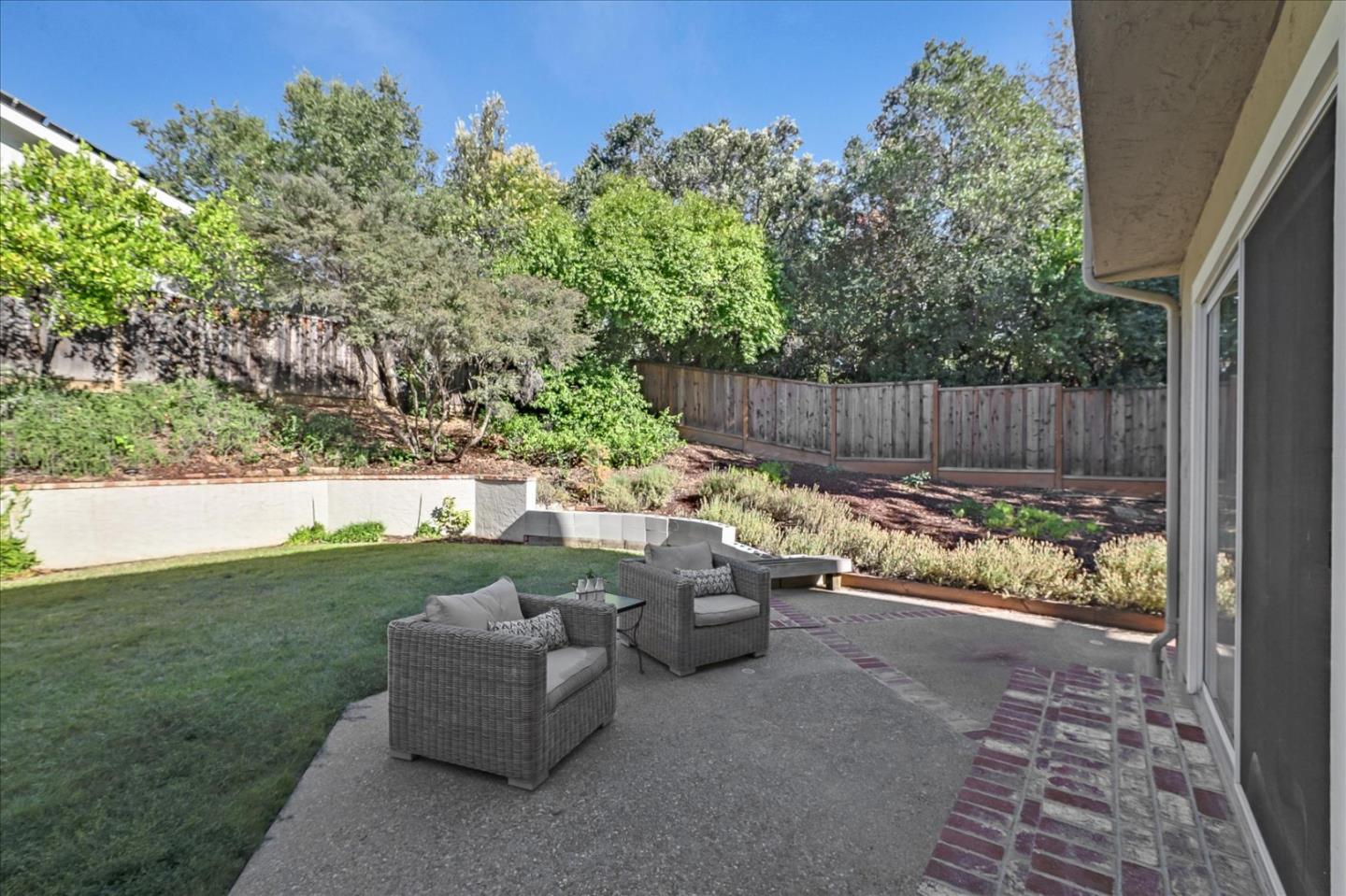 1262 Chateau Drive San Jose, CA 95120 - Photo 49 of 57 a view of a backyard with couches plants and large trees