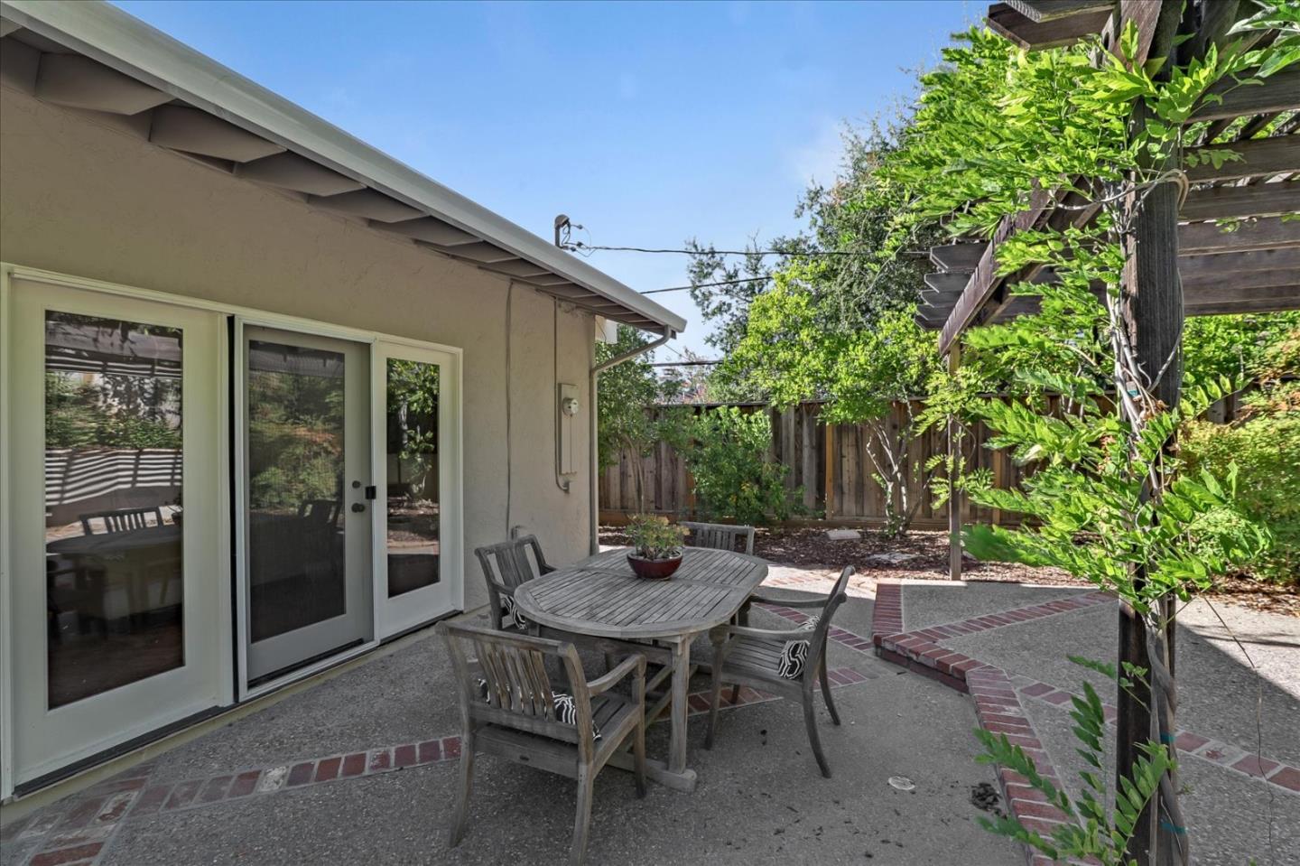 1262 Chateau Drive San Jose, CA 95120 - Photo 51 of 57 a backyard of a house with table and chairs