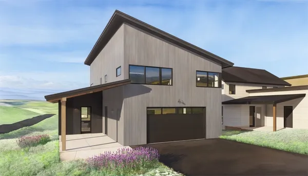 a front view of a house with garage