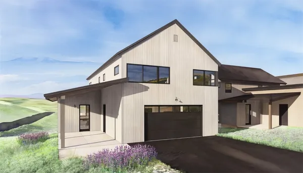 a front view of a house with garage