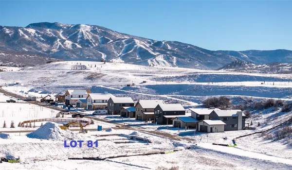 a view of multiple houses with outdoor space