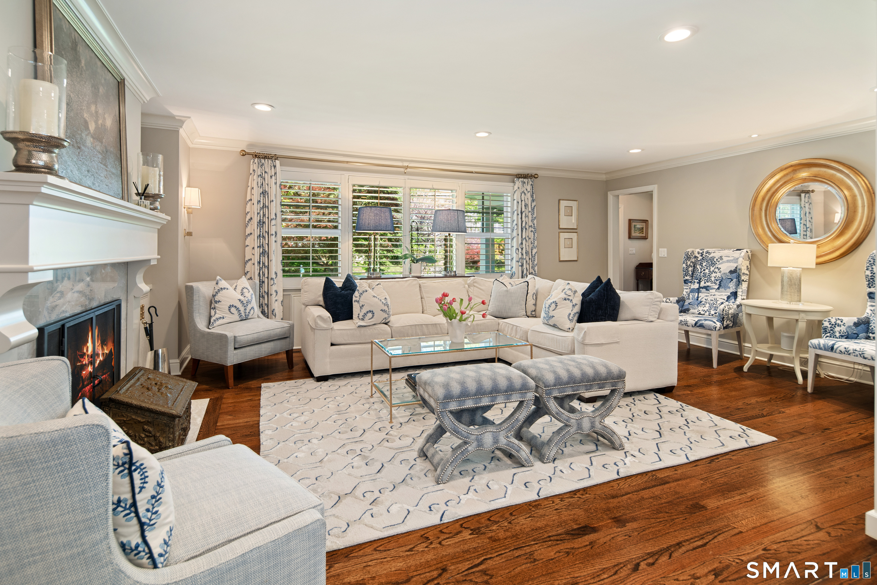 11 McLaren Road South Darien, CT 06820 - Photo 6 of 40 a living room with furniture and a fireplace
