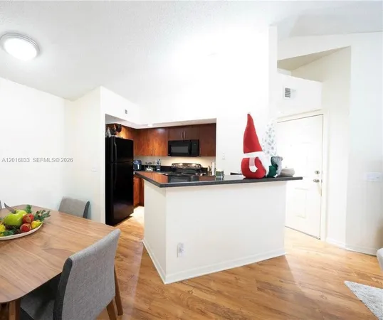 a view of kitchen with wooden floor
