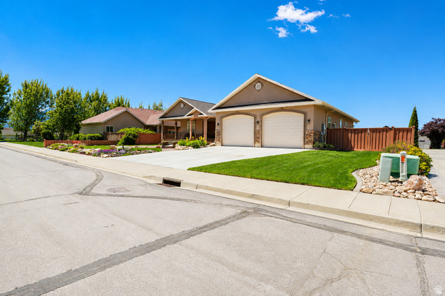 1055 North 1000 East Mapleton, UT 84664 - Photo 108 of 112 Stucco exterior with stone accents and a two-car garage