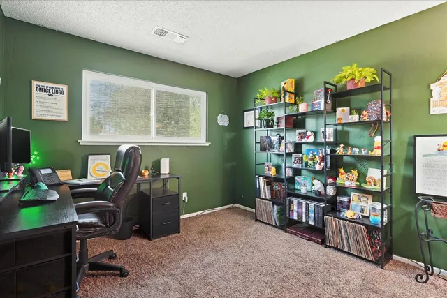 a room with bookshelf and toys