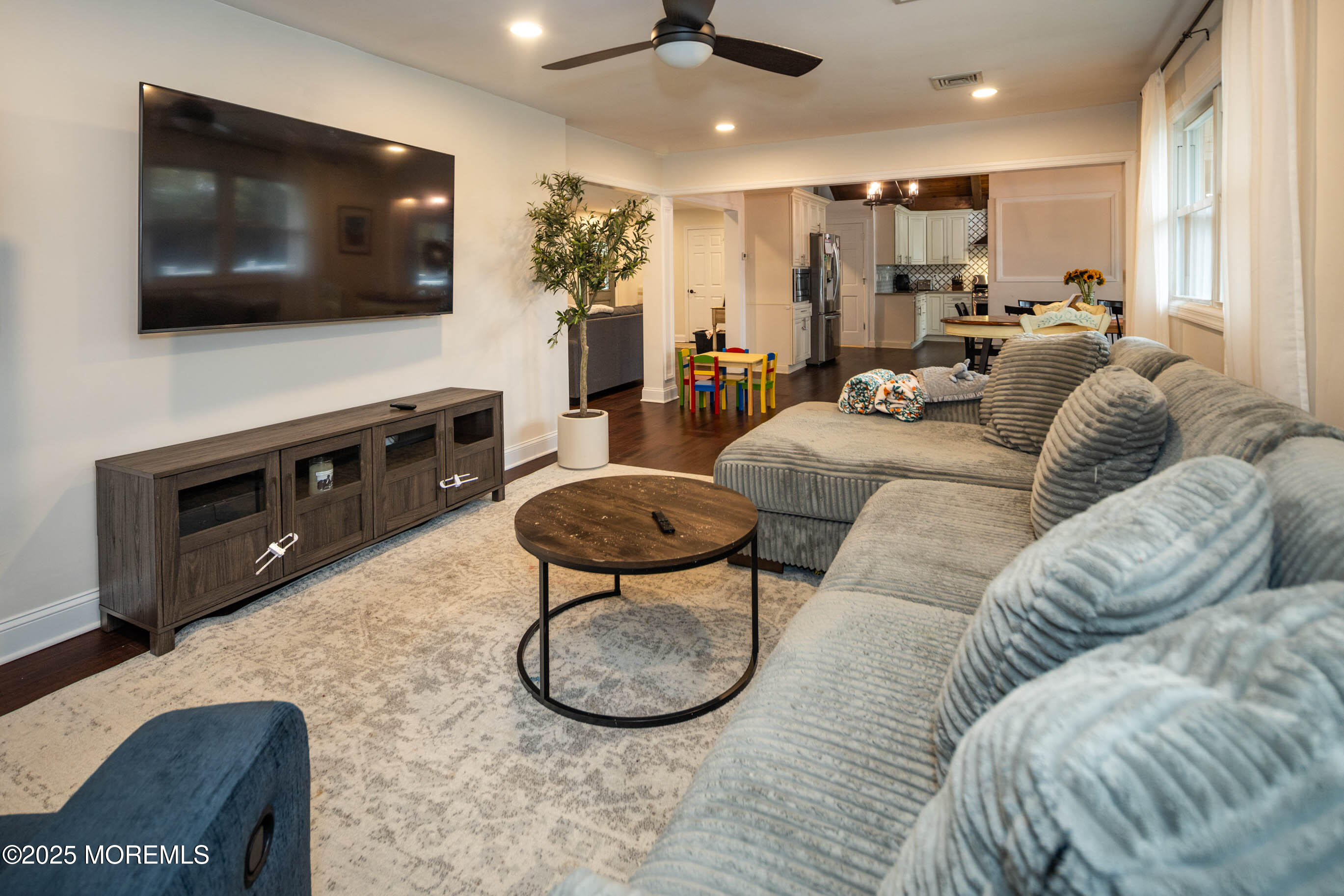 29 Telegraph Hill Road Holmdel, NJ 07733 - Photo 11 of 61 a living room with furniture and a flat screen tv