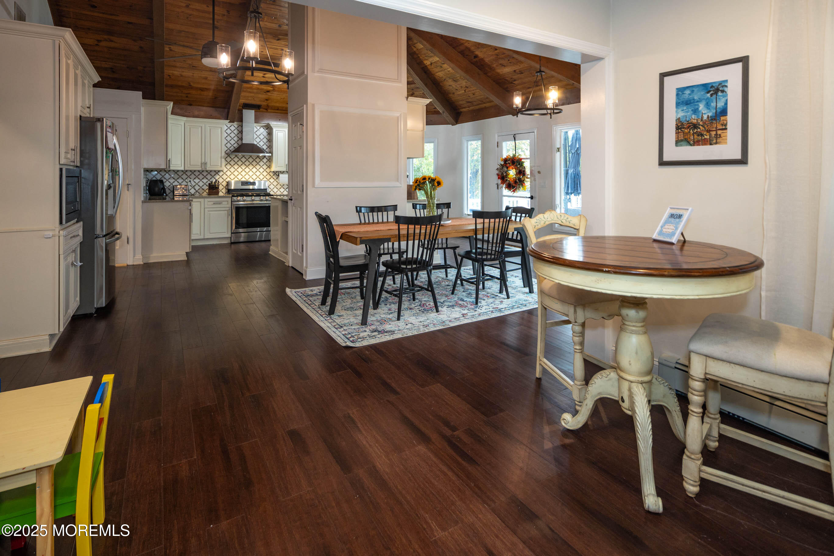 29 Telegraph Hill Road Holmdel, NJ 07733 - Photo 12 of 61 a dining room with furniture a chandelier and wooden floor