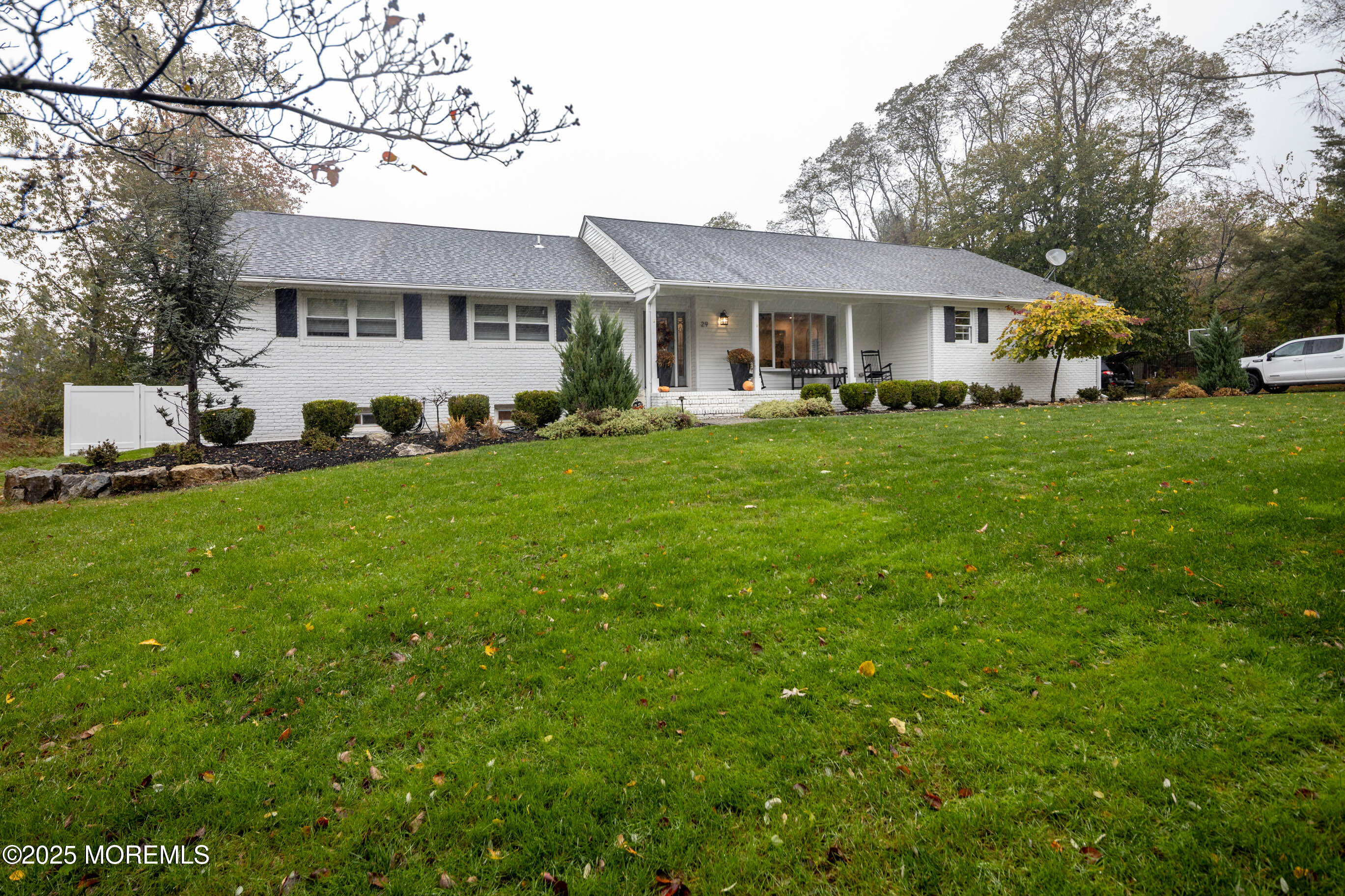 29 Telegraph Hill Road Holmdel, NJ 07733 - Photo 3 of 61 a front view of a house with a yard porch and trees