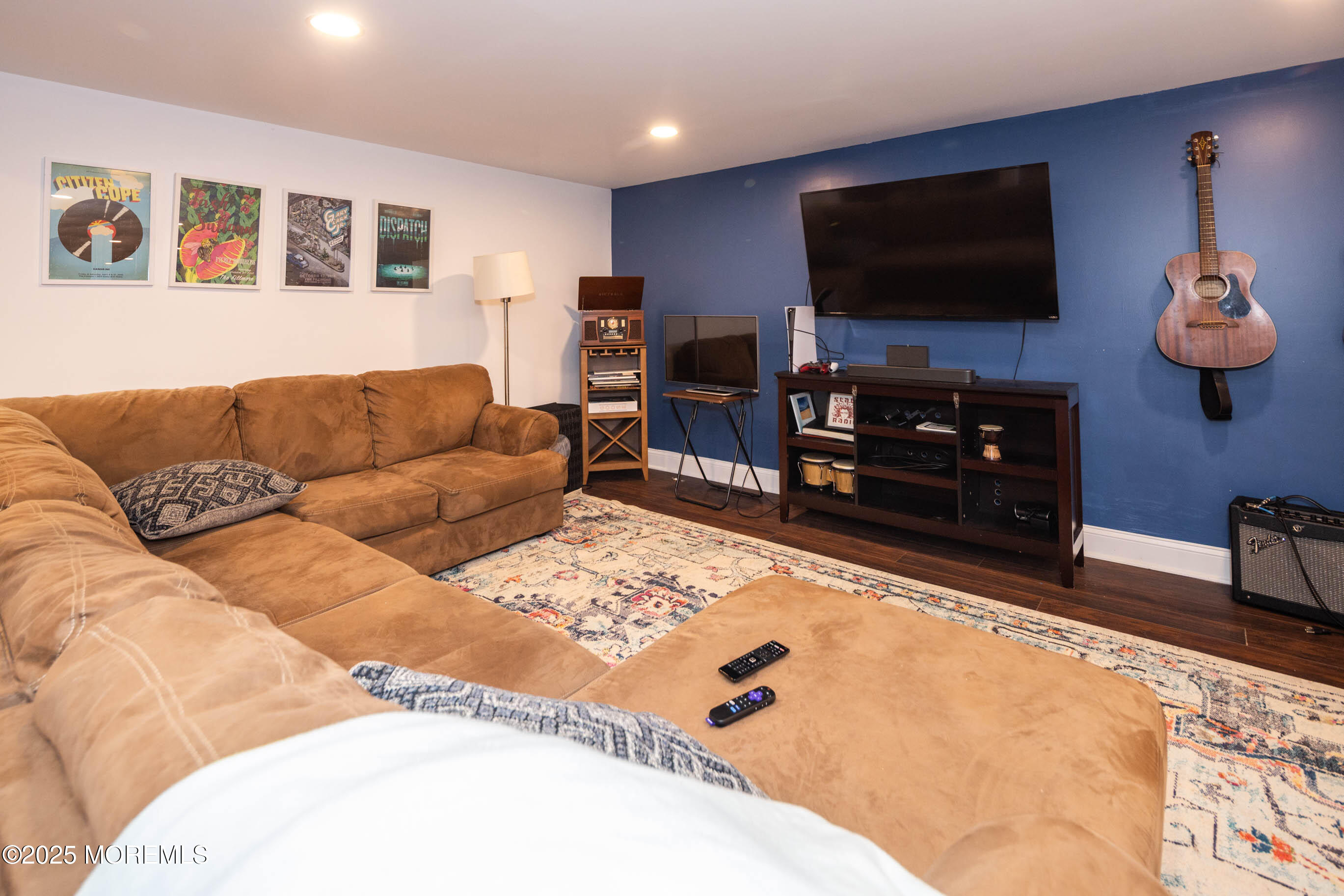 29 Telegraph Hill Road Holmdel, NJ 07733 - Photo 35 of 61 a living room with furniture and a flat screen tv