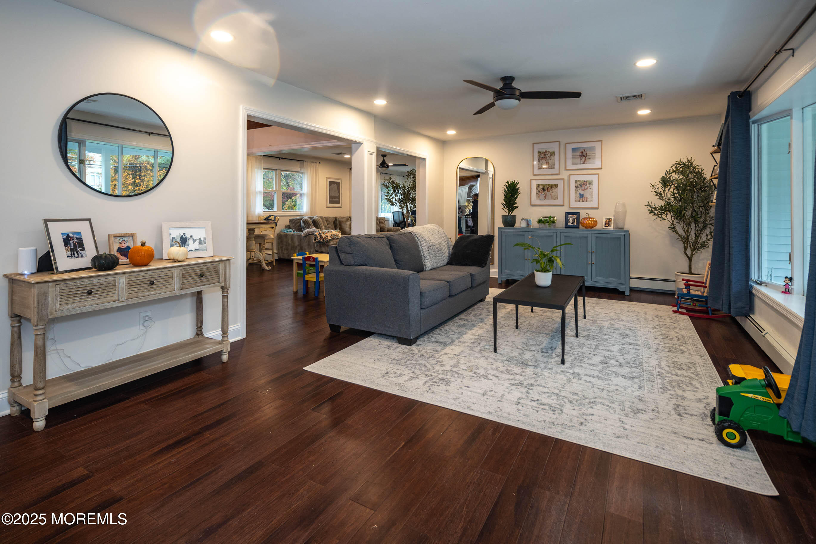 29 Telegraph Hill Road Holmdel, NJ 07733 - Photo 4 of 61 a living room with furniture and a flat screen tv