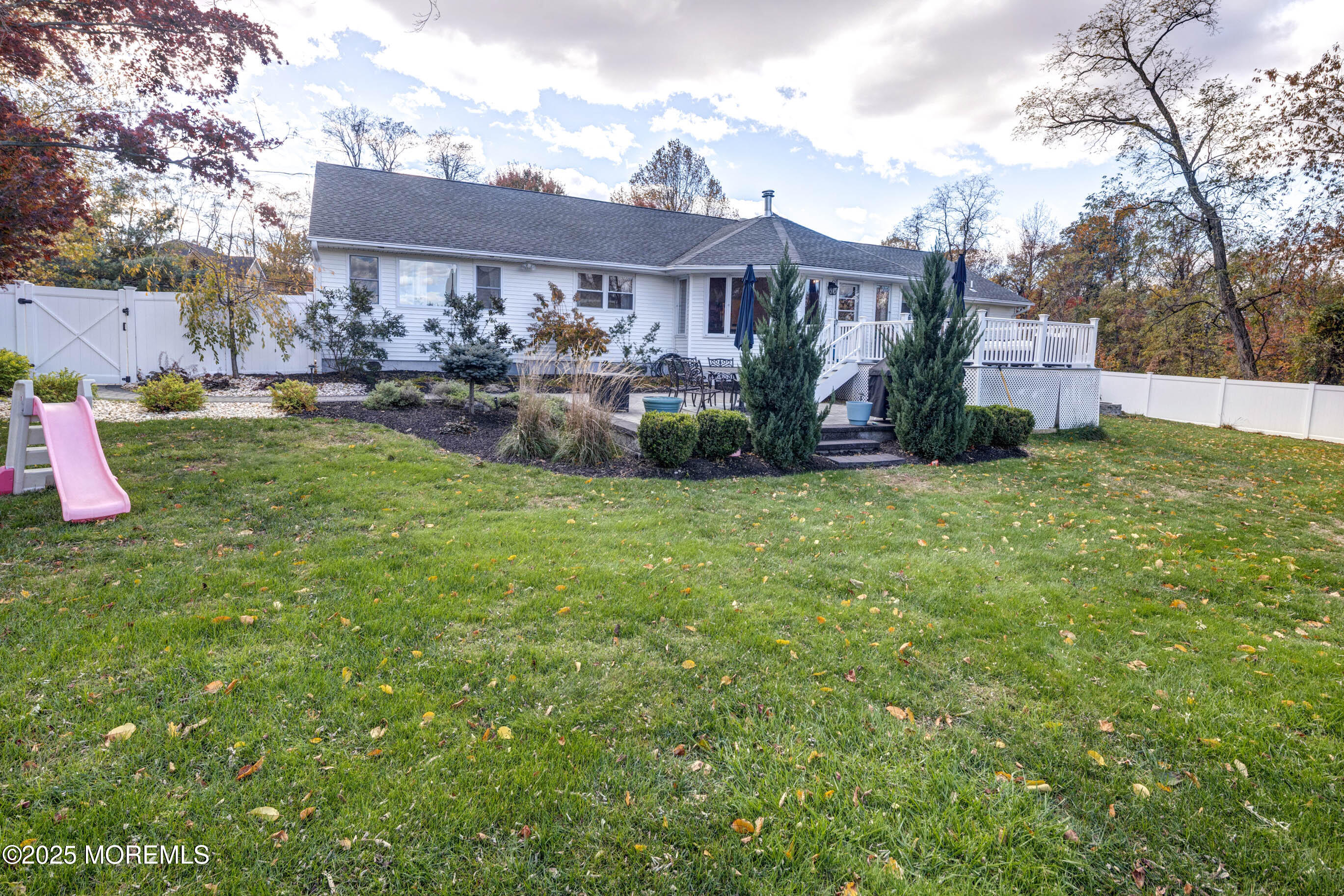 29 Telegraph Hill Road Holmdel, NJ 07733 - Photo 45 of 61 a view of a house with a yard and a patio