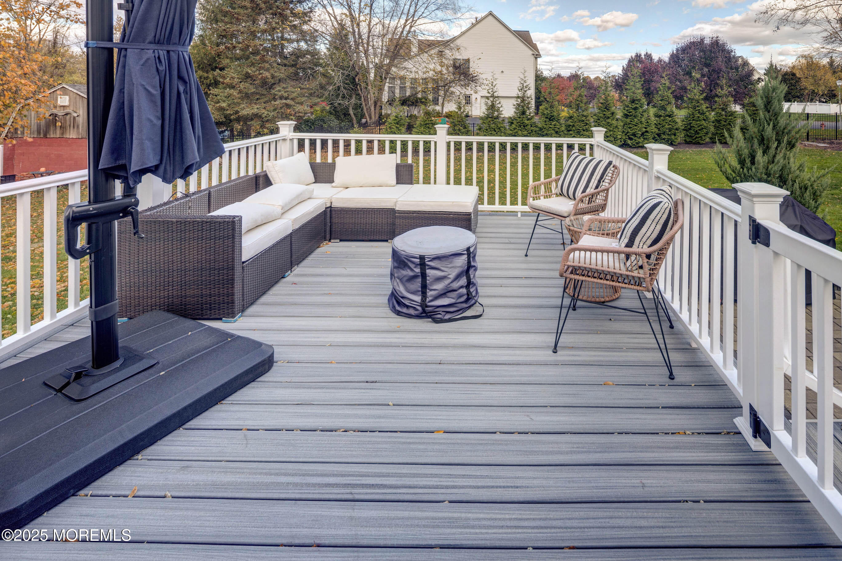 29 Telegraph Hill Road Holmdel, NJ 07733 - Photo 49 of 61 a balcony with wooden floor and outdoor seating