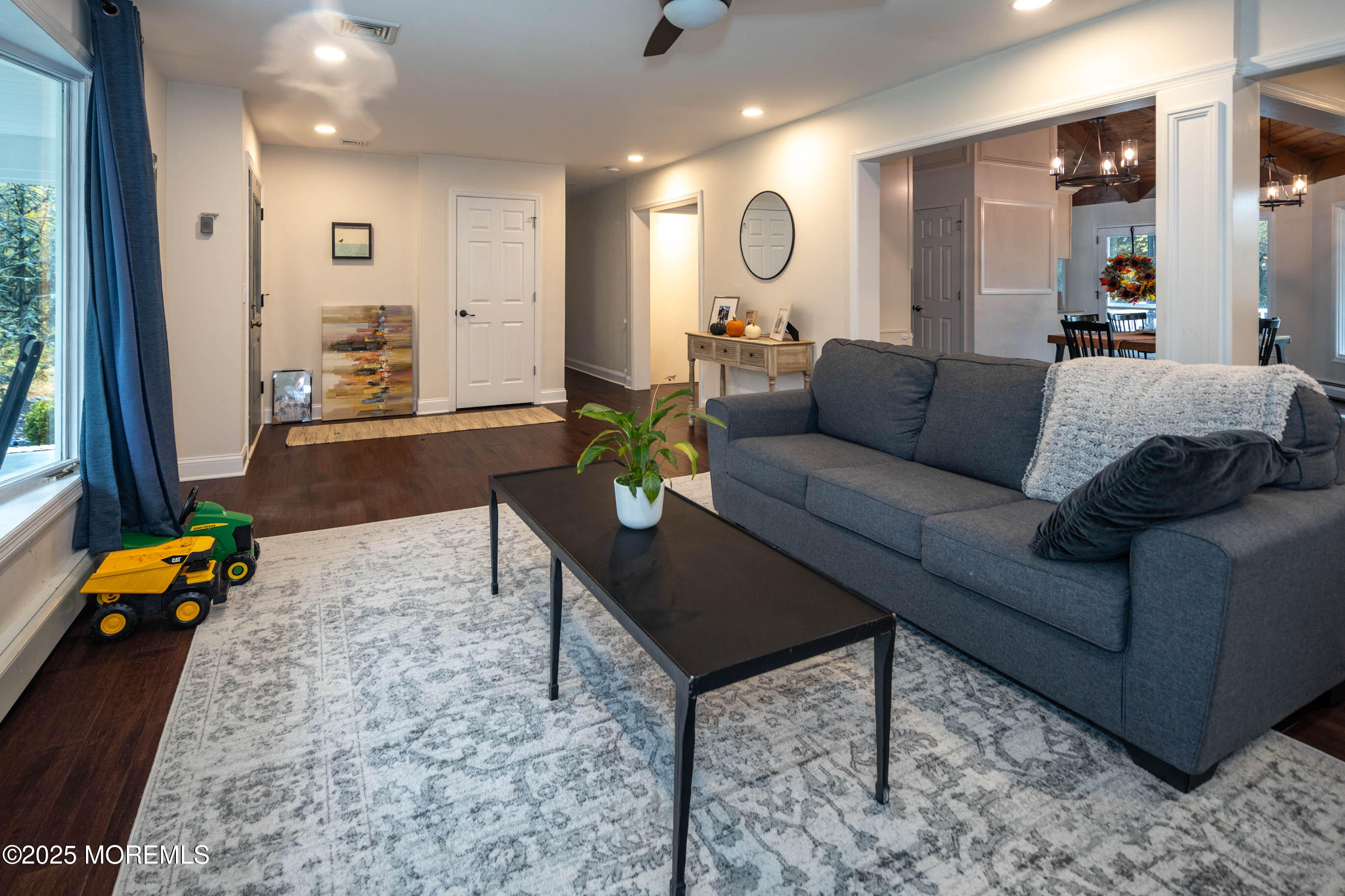29 Telegraph Hill Road Holmdel, NJ 07733 - Photo 7 of 61 a living room with furniture and a chandelier
