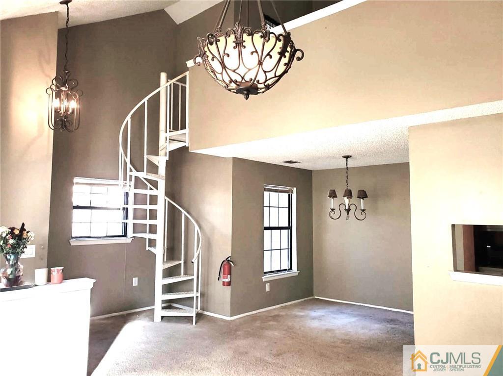 242 Azalea Circle Jackson, NJ 08527 - Photo 2 of 8 a view of livingroom with furniture and chandelier fan