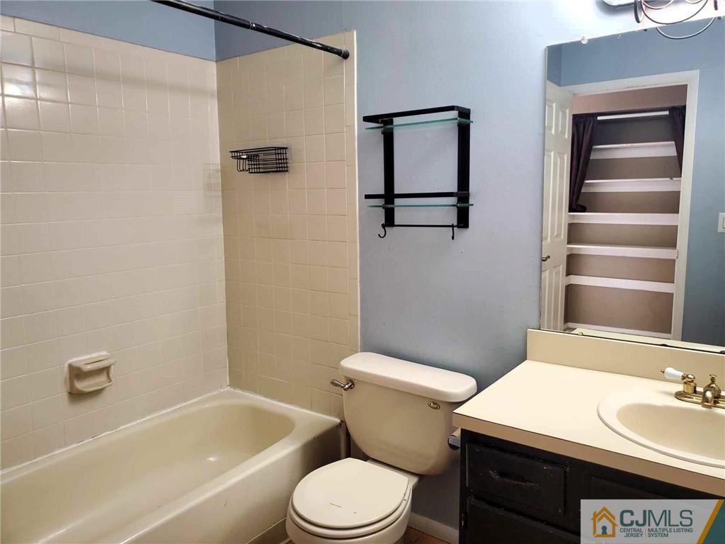242 Azalea Circle Jackson, NJ 08527 - Photo 8 of 8 a bathroom with a sink a toilet and shower