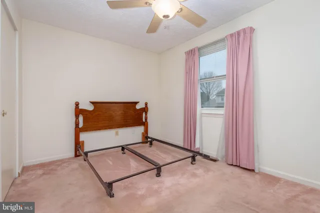 a bathroom with a sink a toilet and shower curtain