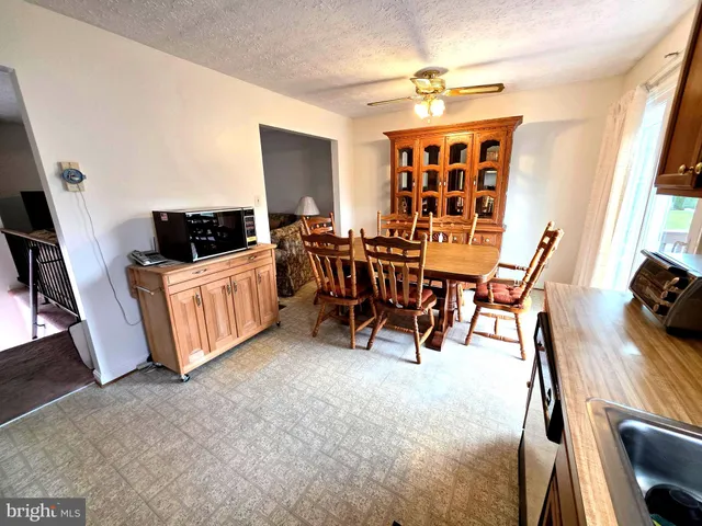 a view of a big room with furniture window and wooden floor