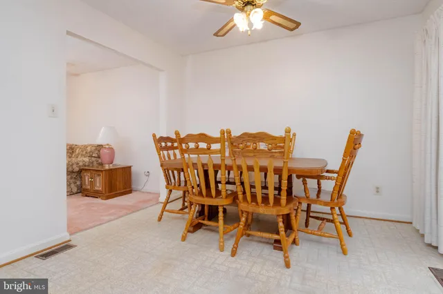 a kitchen with a refrigerator sink and cabinets
