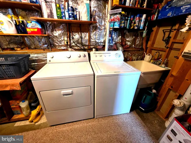 a bedroom with furniture and a flat screen tv