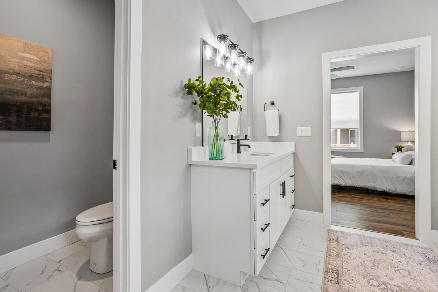 5016 Trey Boulevard Champaign, IL 61822 - Photo 18 of 38 a bathroom with a sink a toilet and a mirror