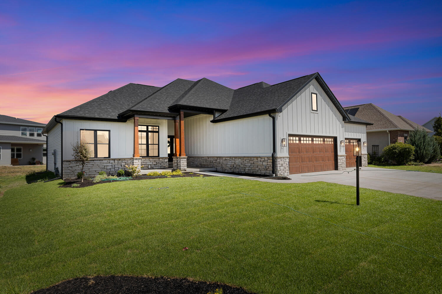5016 Trey Boulevard Champaign, IL 61822 - Photo 2 of 38 a front view of a house with a garden and yard
