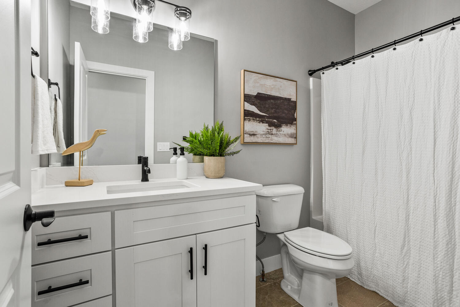 5016 Trey Boulevard Champaign, IL 61822 - Photo 22 of 38 a bathroom with a toilet a sink and mirror