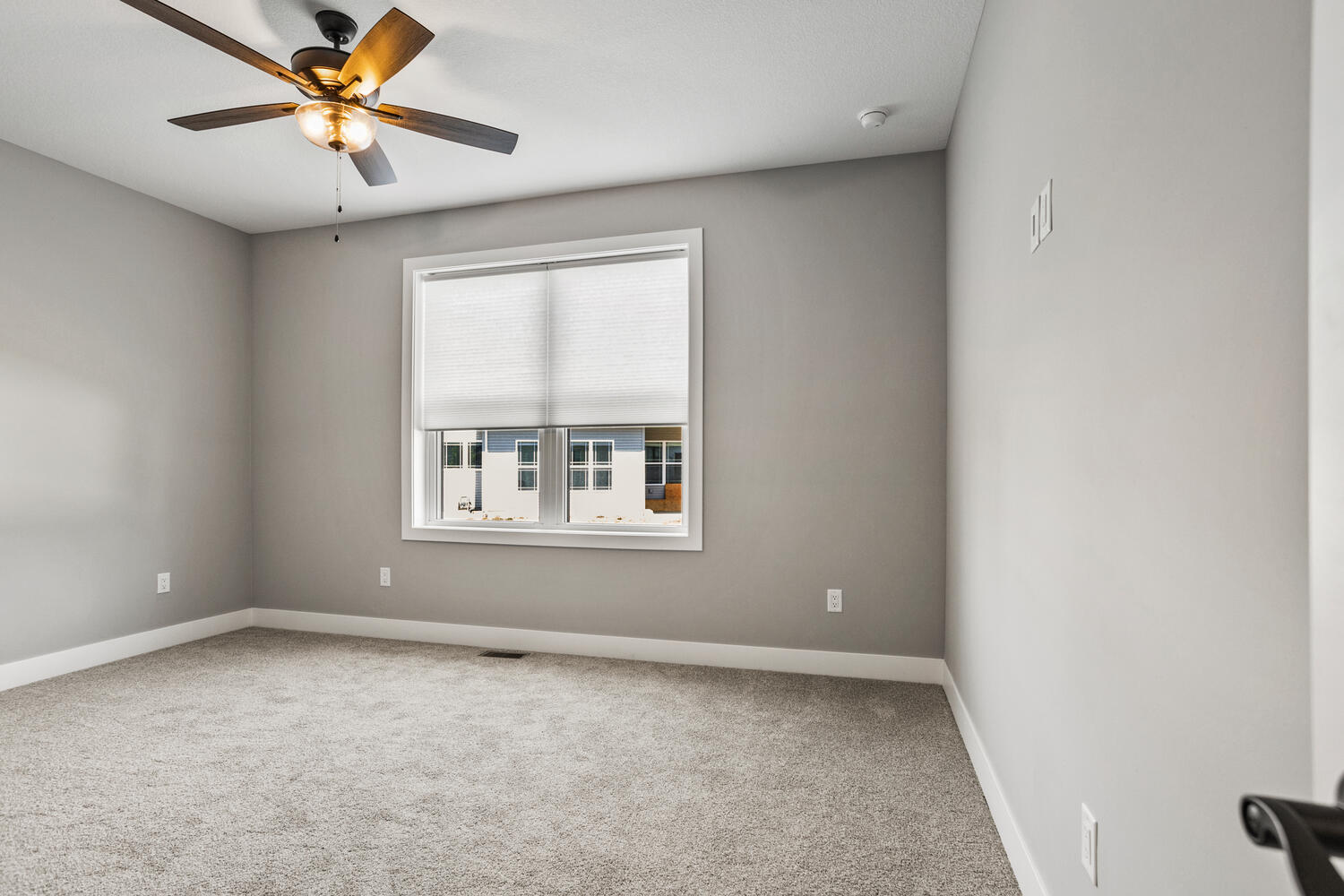 5016 Trey Boulevard Champaign, IL 61822 - Photo 23 of 38 an empty room with a window and a fan