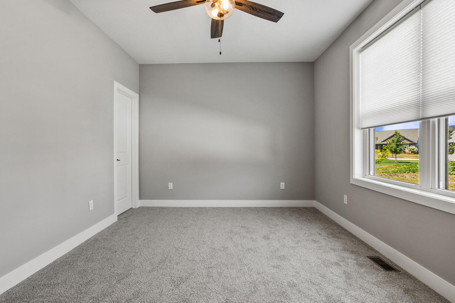 5016 Trey Boulevard Champaign, IL 61822 - Photo 24 of 38 an empty room with windows and chandelier fan