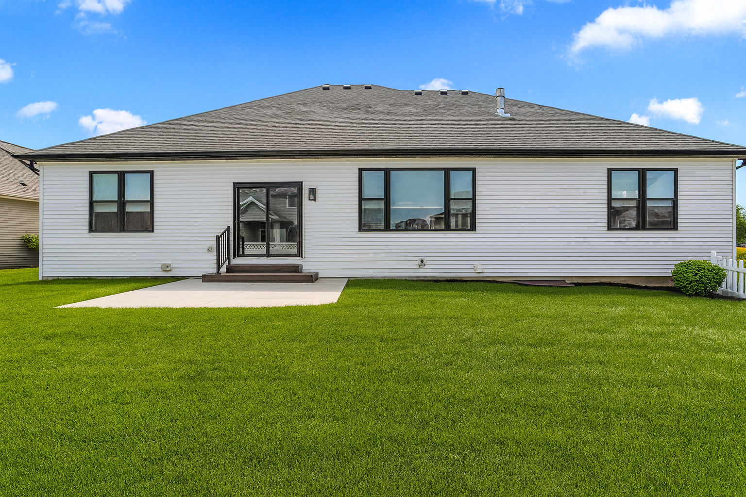 5016 Trey Boulevard Champaign, IL 61822 - Photo 35 of 38 a front view of a house with garden