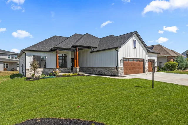 a front view of house with yard and porch