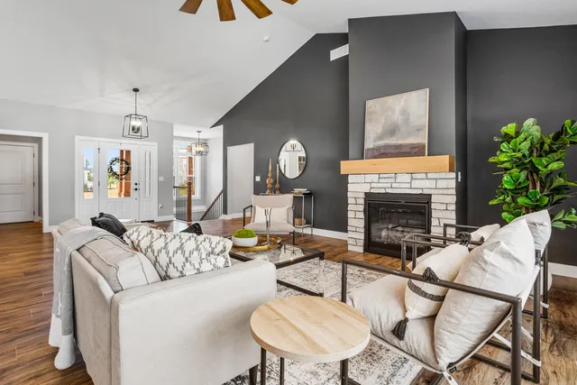 a living room with furniture and a fireplace