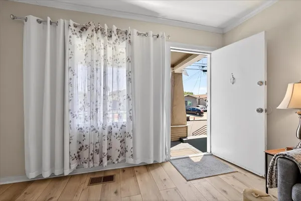 a view of a room with wooden floor and walls