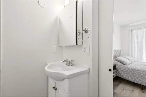 a bathroom with a sink and a mirror