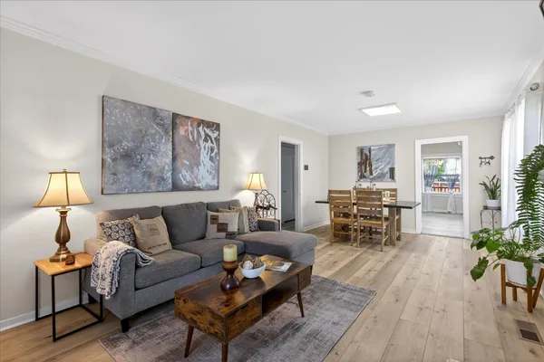 a living room with furniture and a lamp