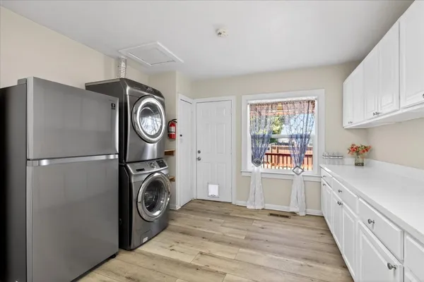a view of a kitchen with washer and dryer
