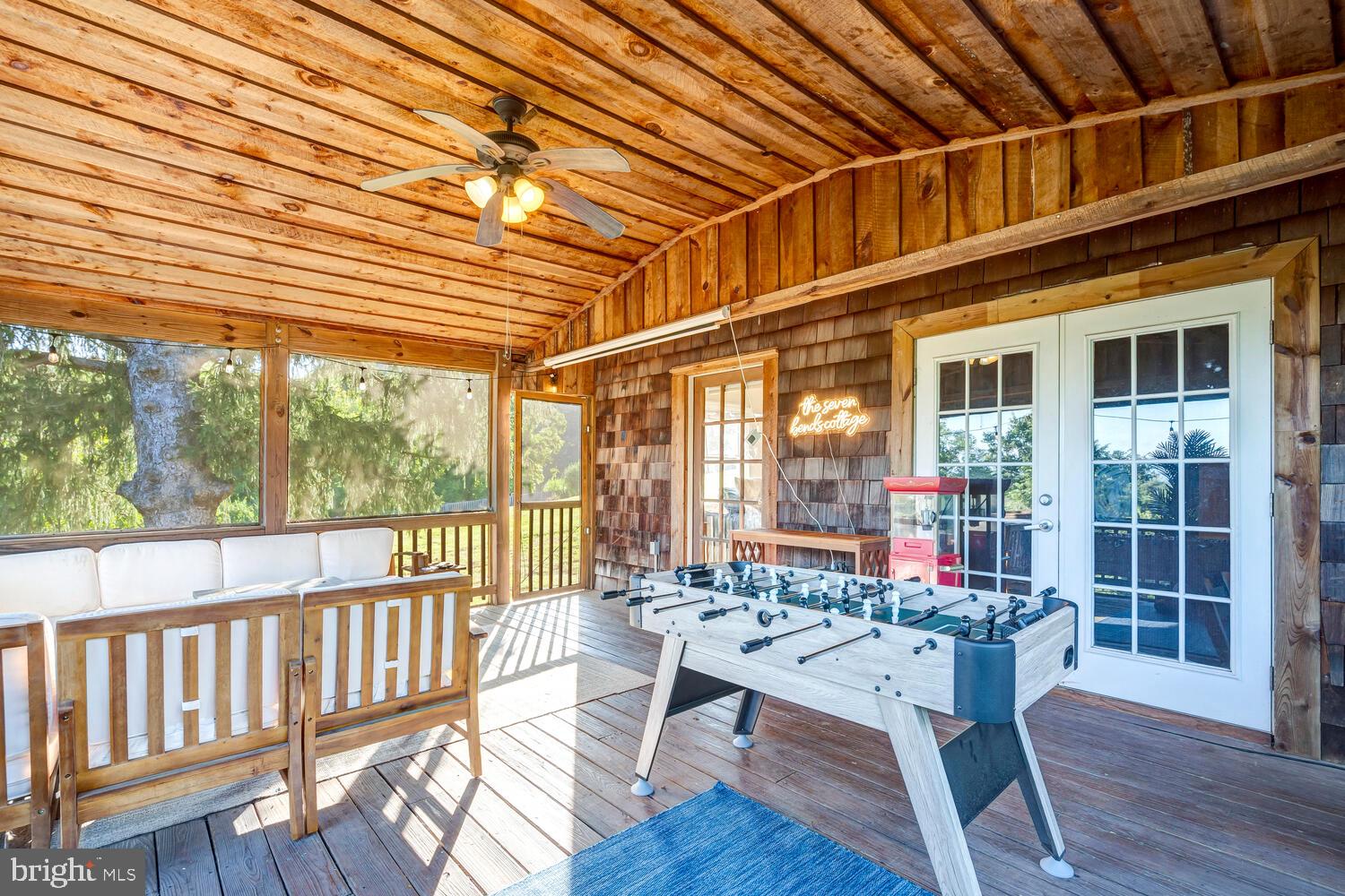 6235 South Page Valley Road Luray, VA 22835 - Photo 27 of 52 Charming porch with game table fun.