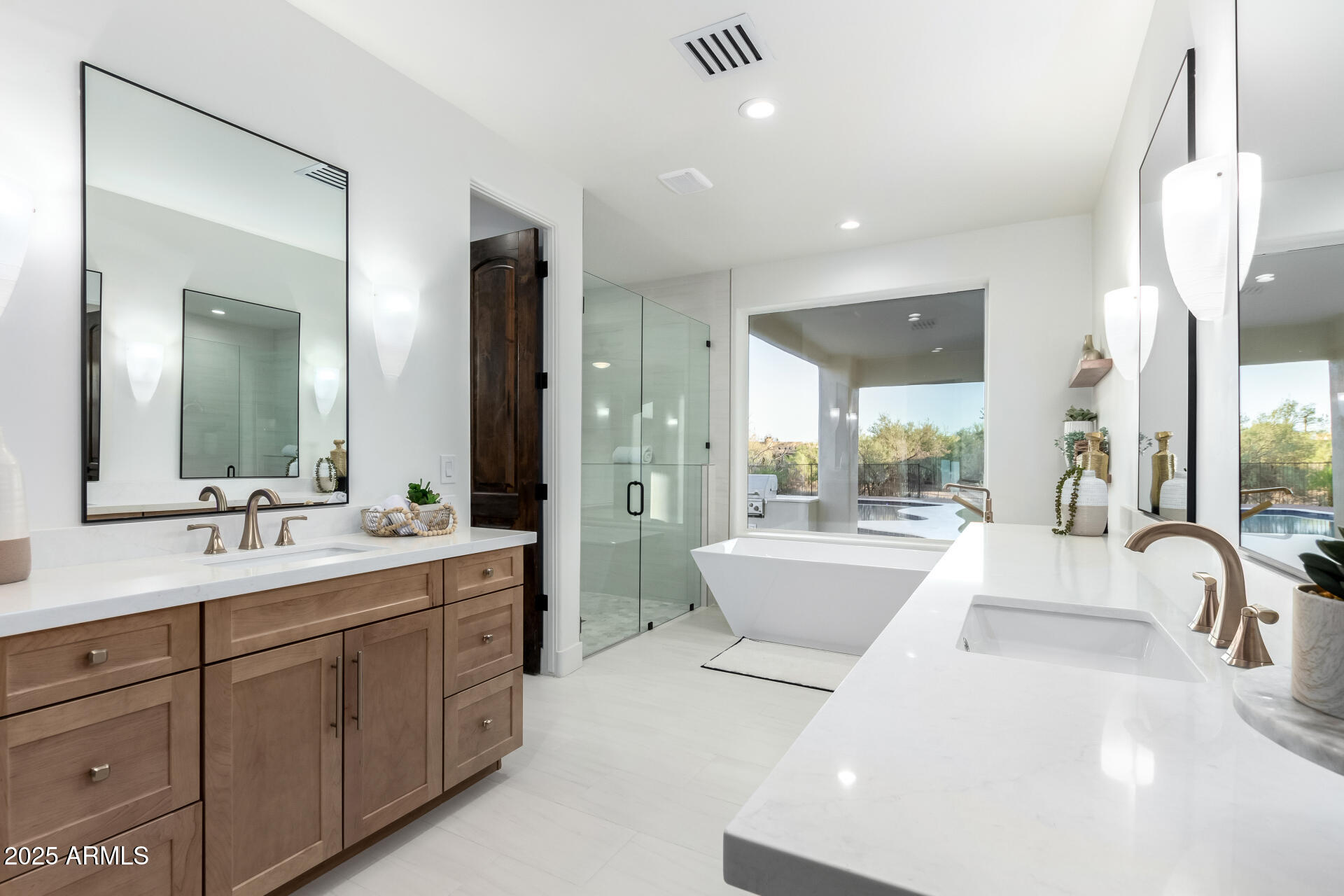 6735 East Dove Valley Road Cave Creek, AZ 85331 - Photo 28 of 58 a large white bathroom with a large tub sink and vanity