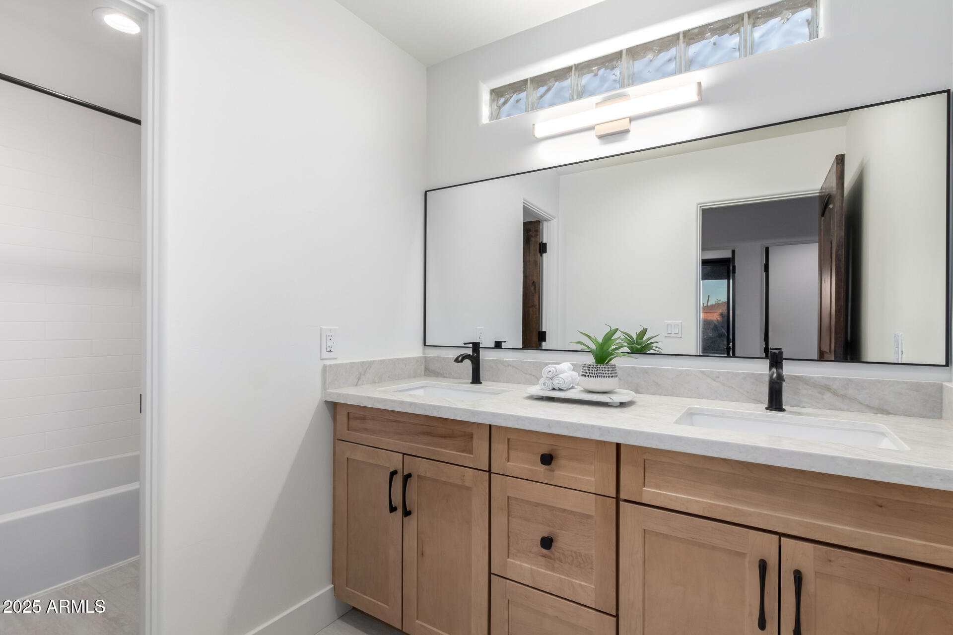 6735 East Dove Valley Road Cave Creek, AZ 85331 - Photo 34 of 58 a bathroom with a granite countertop sink and a mirror