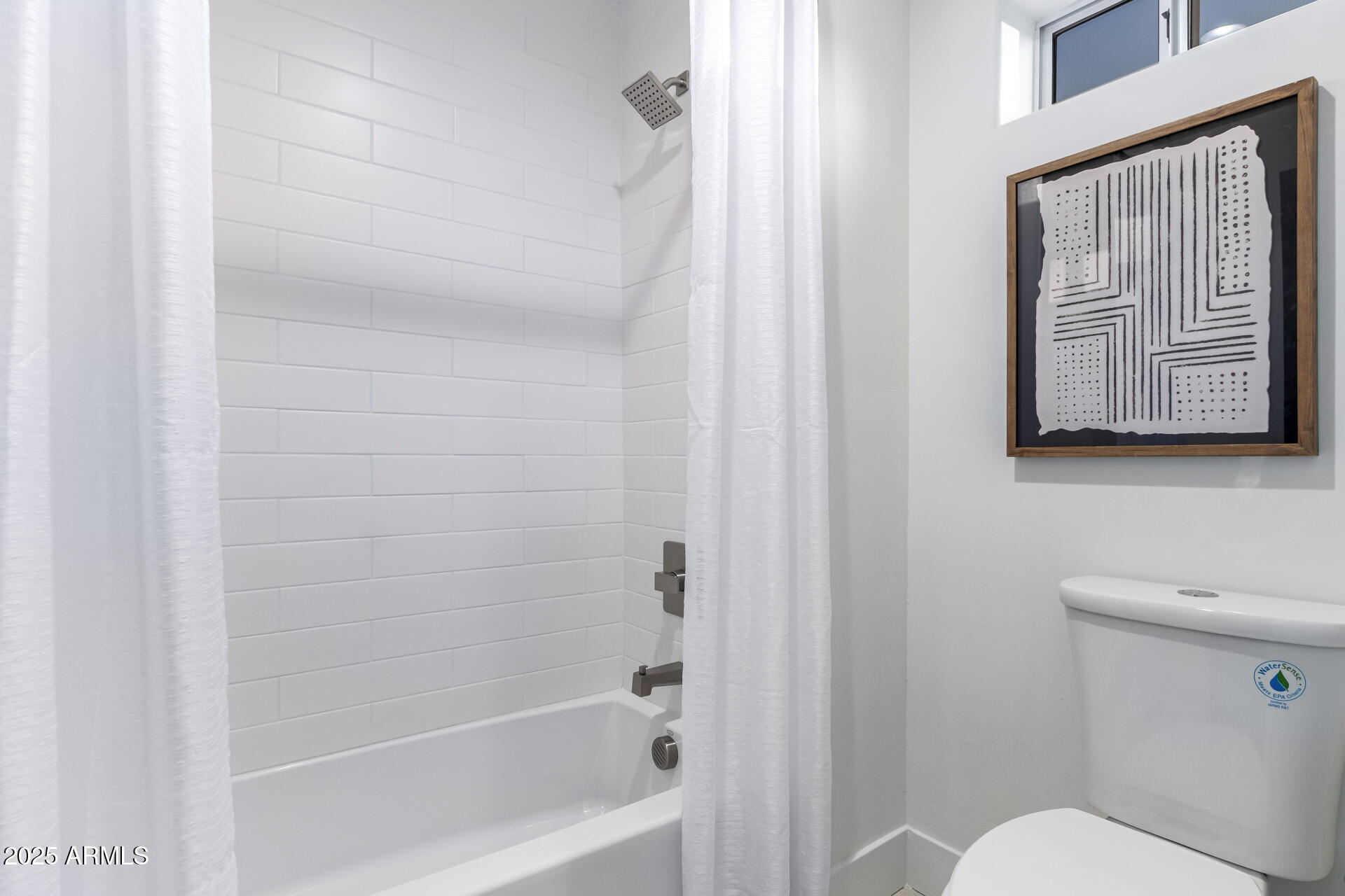 6735 East Dove Valley Road Cave Creek, AZ 85331 - Photo 35 of 58 a bathroom with a toilet and a shower curtain