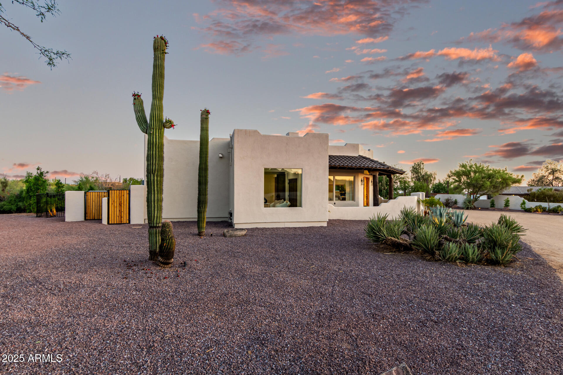 6735 East Dove Valley Road Cave Creek, AZ 85331 - Photo 4 of 58 a front view of a house with garden