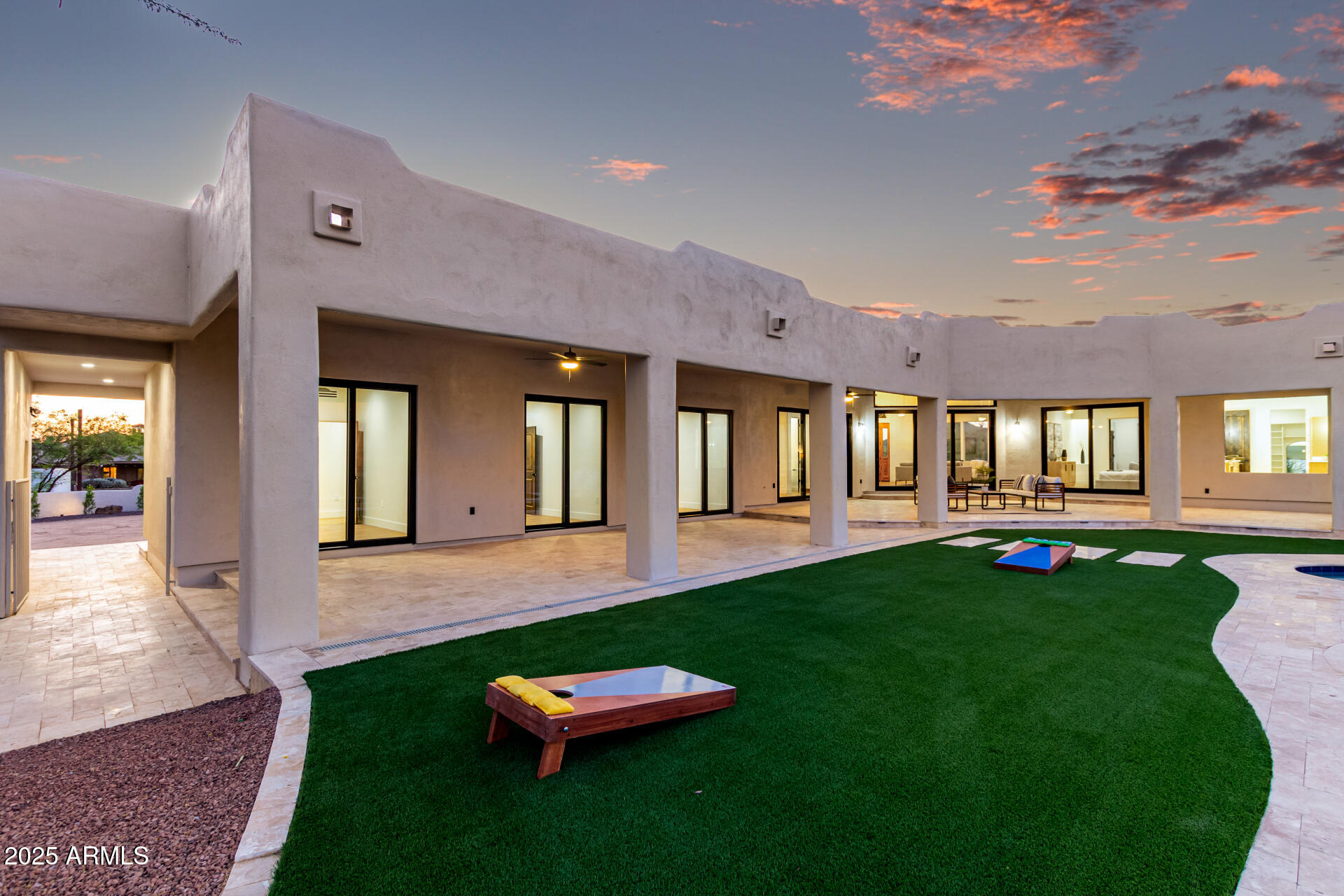 6735 East Dove Valley Road Cave Creek, AZ 85331 - Photo 44 of 58 a front view of a house with a yard table and chairs