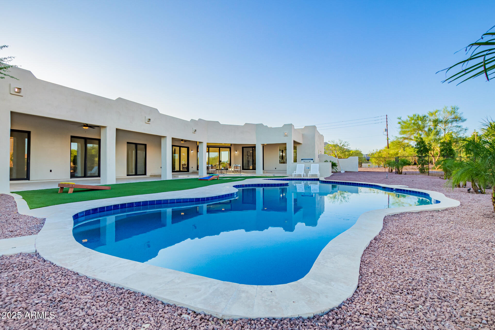 6735 East Dove Valley Road Cave Creek, AZ 85331 - Photo 56 of 58 a view of a house with swimming pool