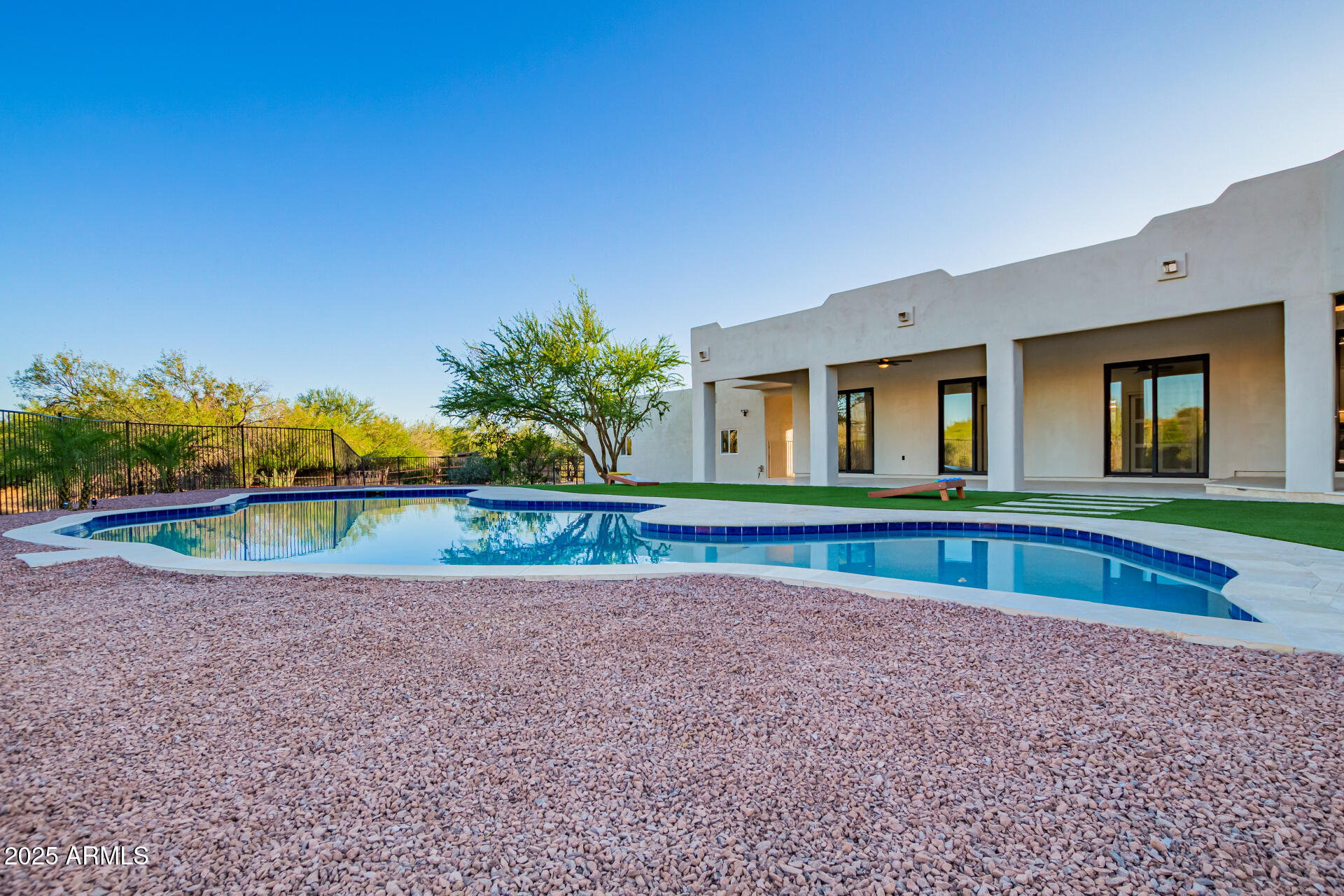 6735 East Dove Valley Road Cave Creek, AZ 85331 - Photo 57 of 58 a view of house with a big yard and potted plants