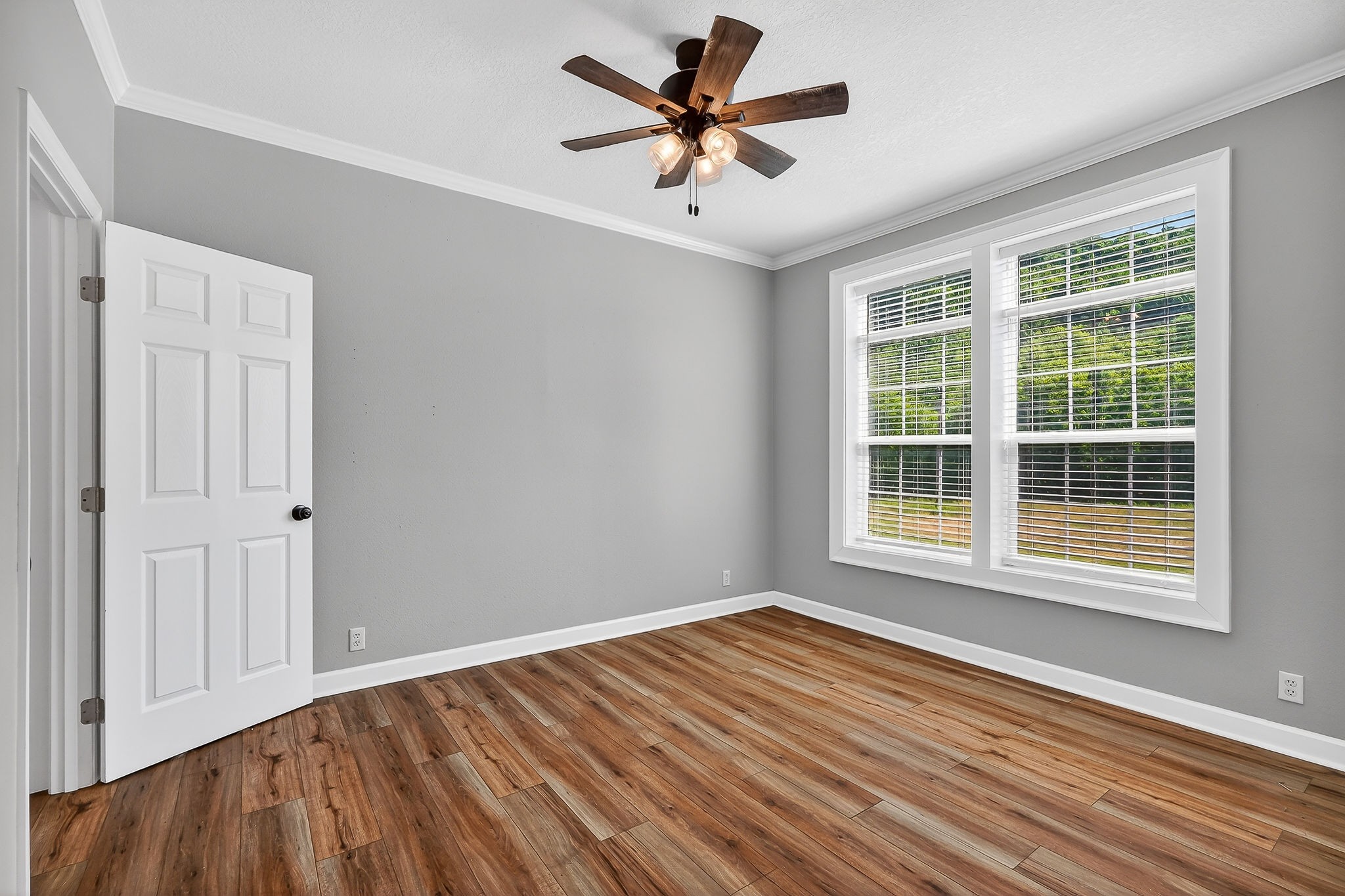 16062 Buffalo Valley Road Silver Point, TN 38582 - Photo 17 of 27 a view of empty room with wooden floor and fan