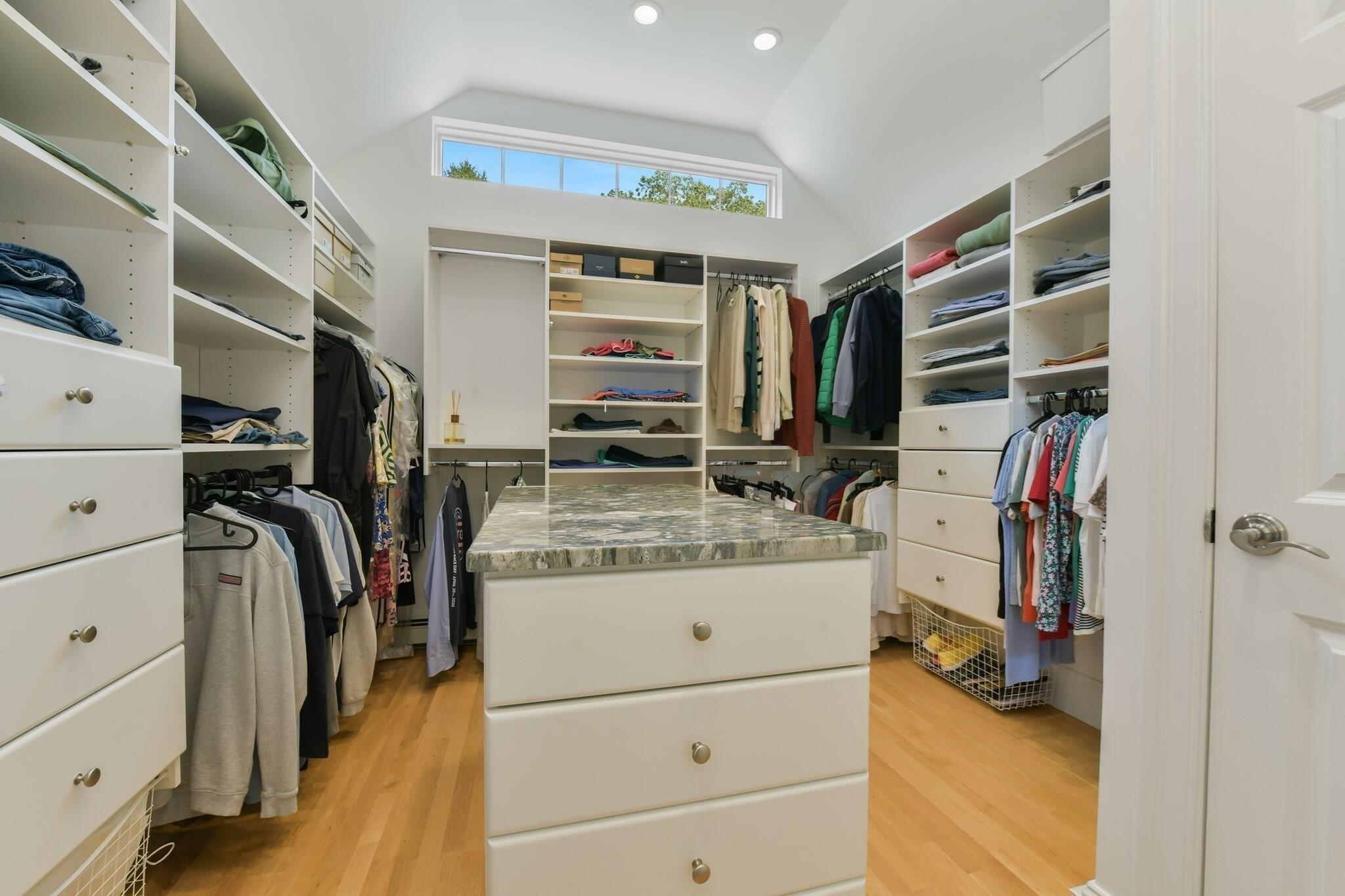 1460 South County Road Osterville, MA 02655 - Photo 19 of 25 a view of walk in closet with clothes and shoes